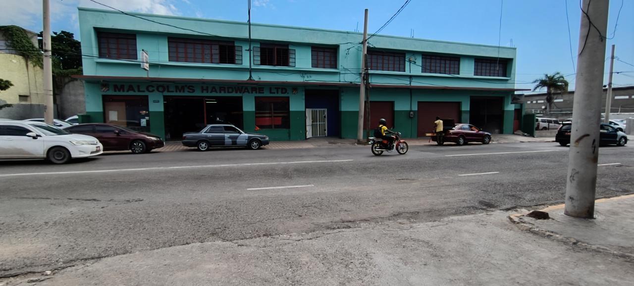 Wider street view of Malcolm's Hardware on Slipe Road, Cross Roads, Kingston